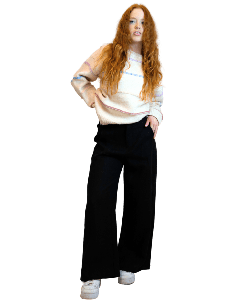 A woman wearing women's linen pants in black